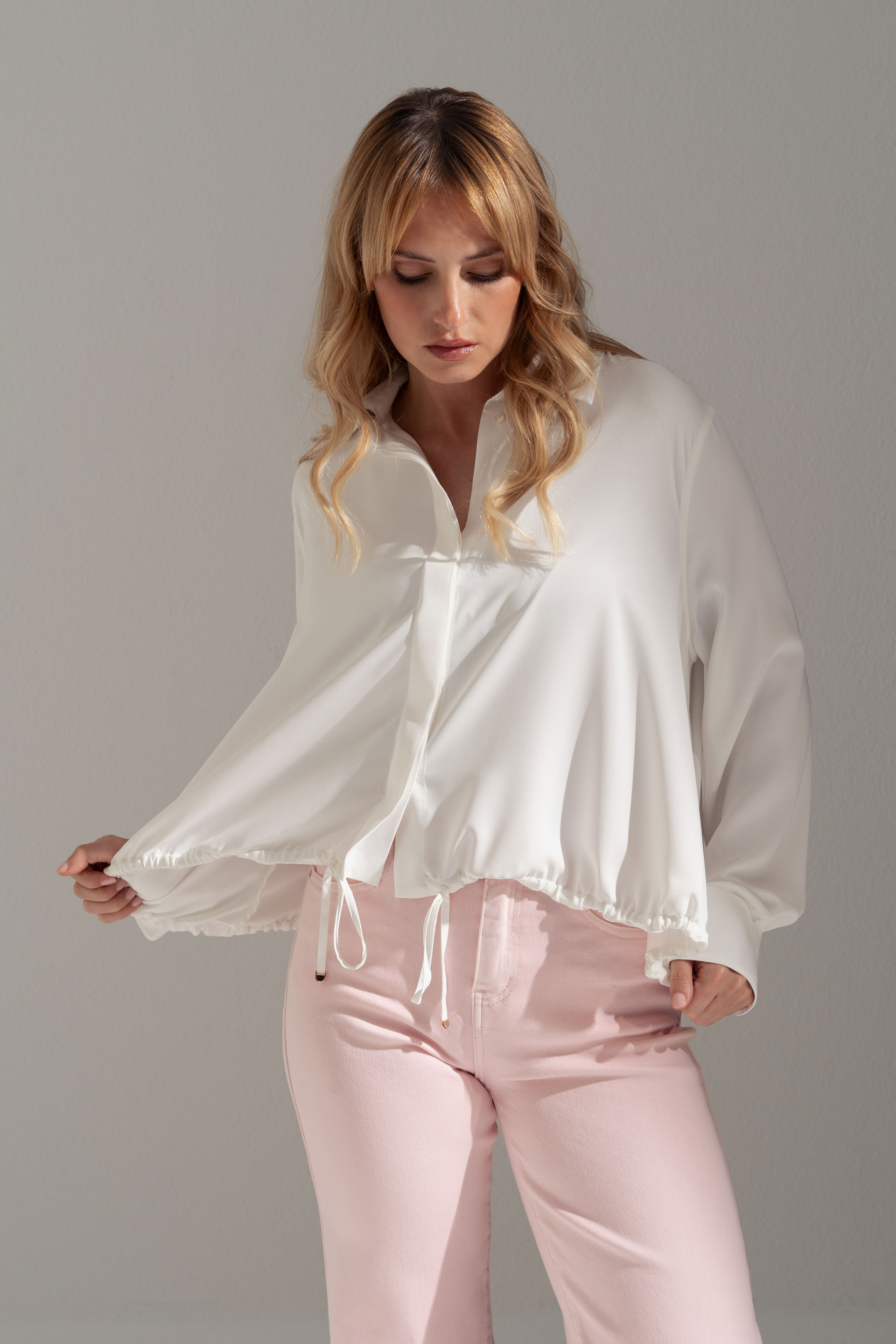 Fluid blouse with adjustable drawstring