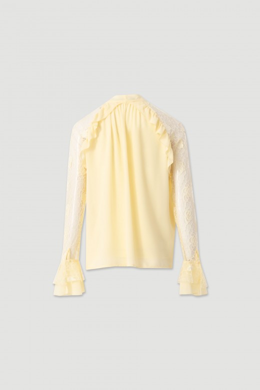 Blouse with bow and lace sleeves Blouse with bow and lace sleeves