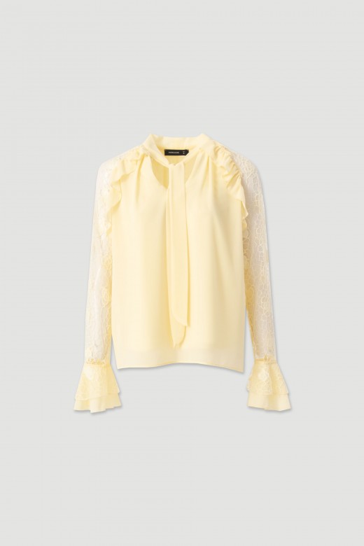 Blouse with bow and lace sleeves Blouse with bow and lace sleeves