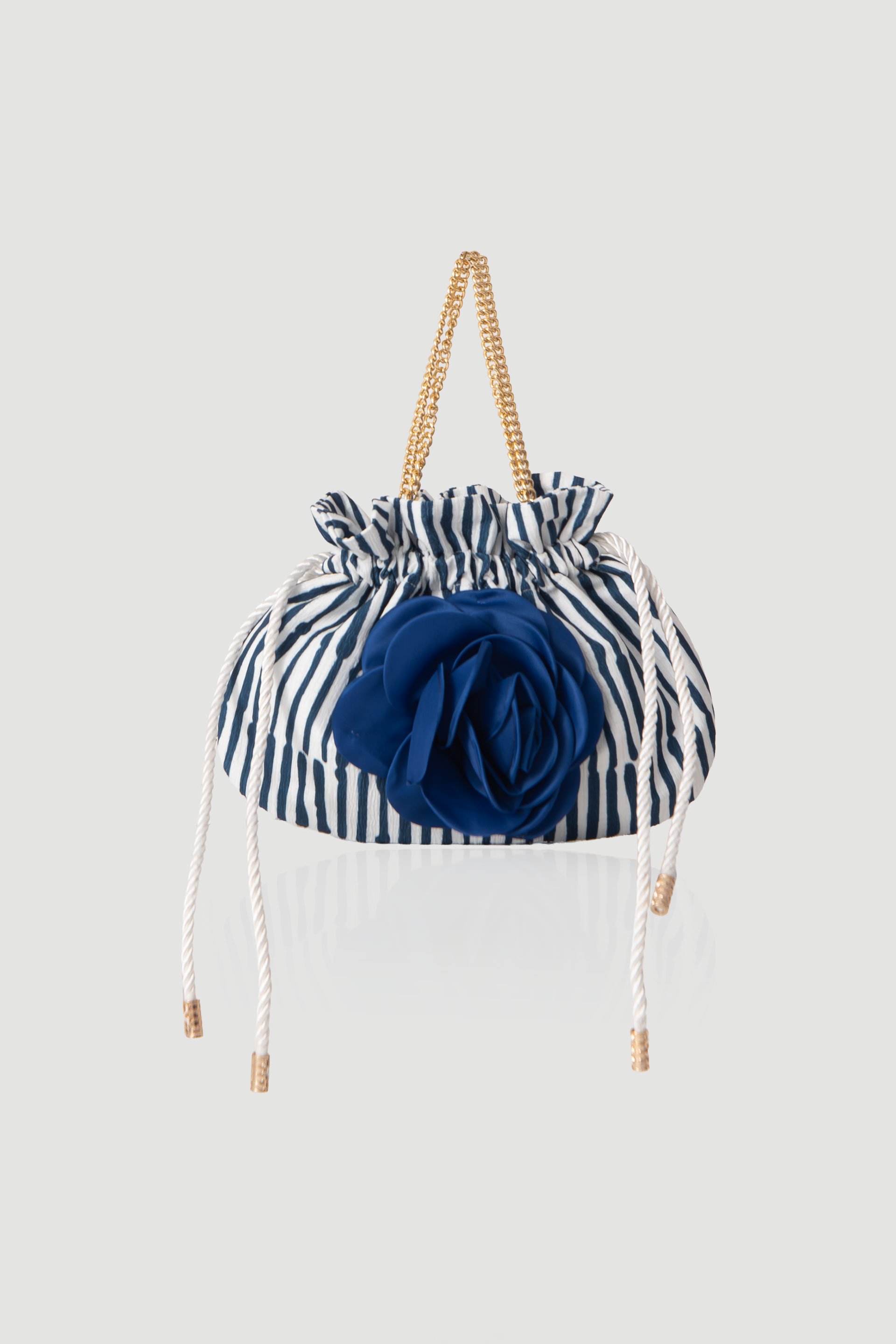 Striped ceremony bag with applied flower