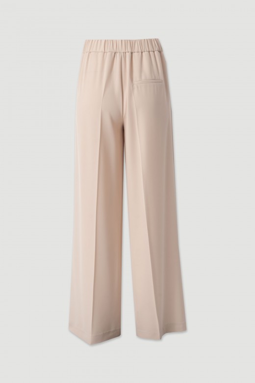 Flowing trousers with gold waist detail Flowing trousers with gold waist detail