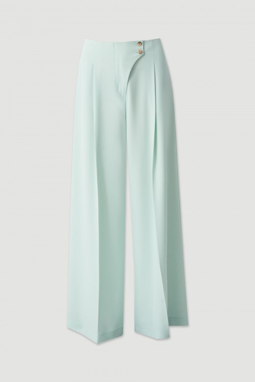 Flowing trousers with cross-over fastening Flowing trousers with cross-over fastening