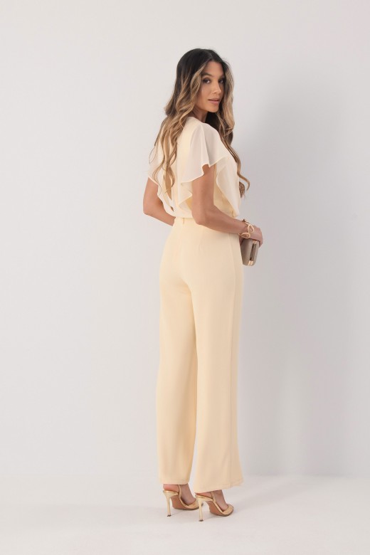 Flowy jumpsuit with a crossover neckline. Flowy jumpsuit with a crossover neckline.