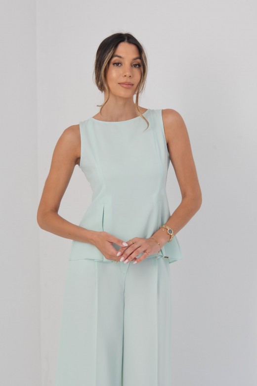 Sleeveless flowing top with side slits Sleeveless flowing top with side slits