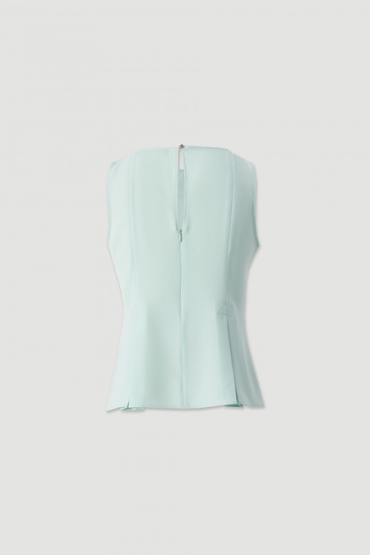Sleeveless flowing top with side slits Sleeveless flowing top with side slits