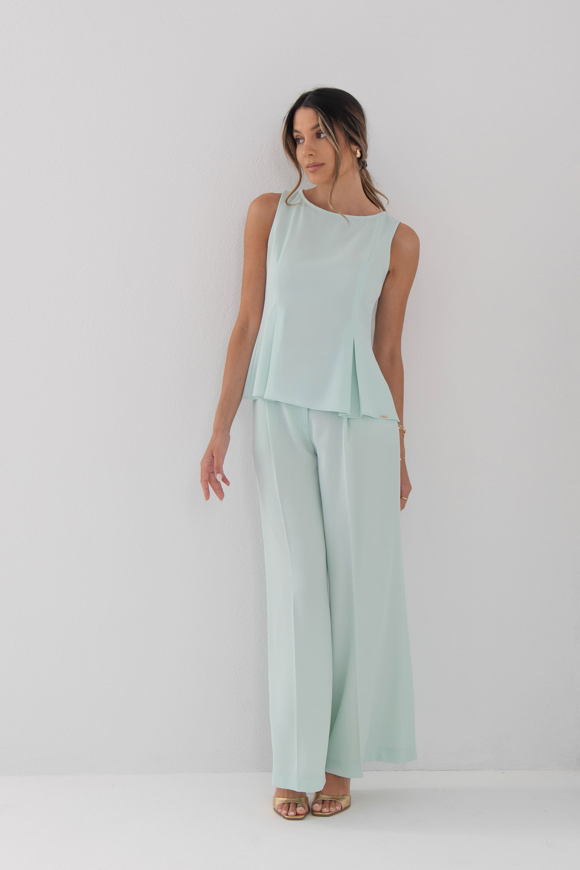 Sleeveless flowing top with side slits