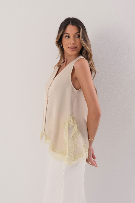 Asymmetrical satin blouse with lace trim
