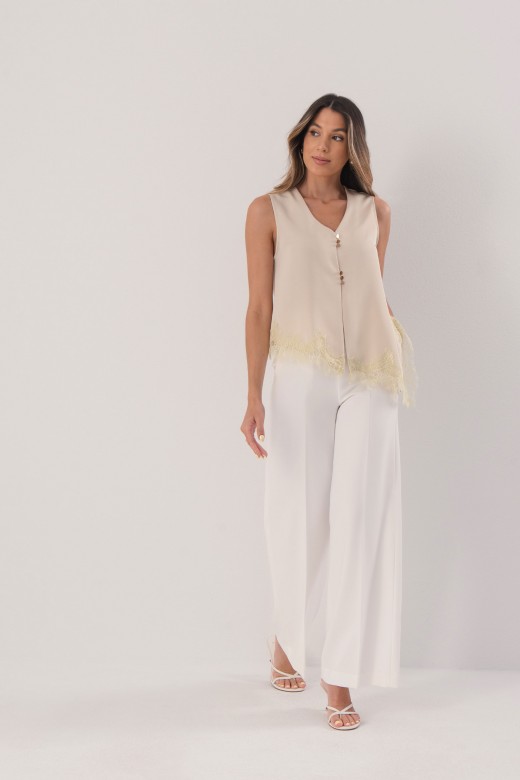 Asymmetrical satin blouse with lace trim Asymmetrical satin blouse with lace trim