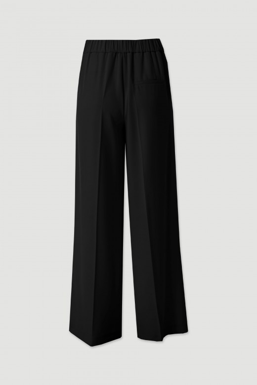 Flowing trousers with gold waist detail Flowing trousers with gold waist detail