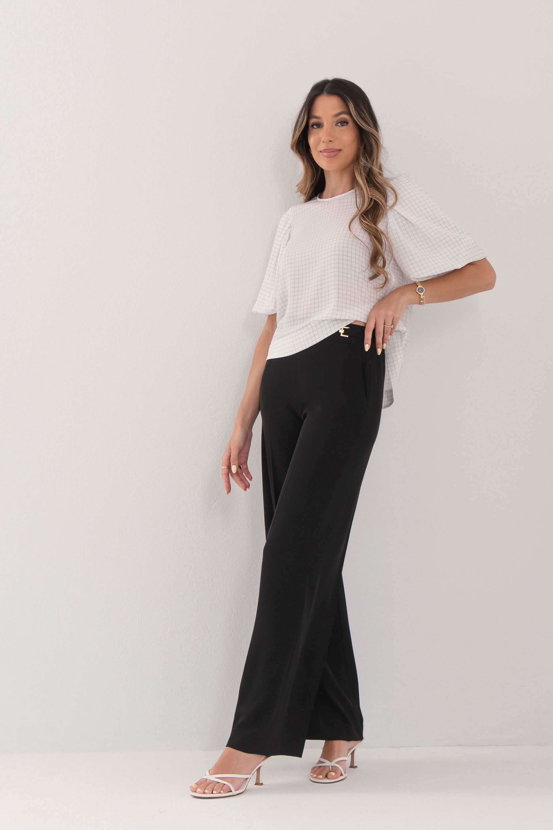 Flowing trousers with gold waist detail