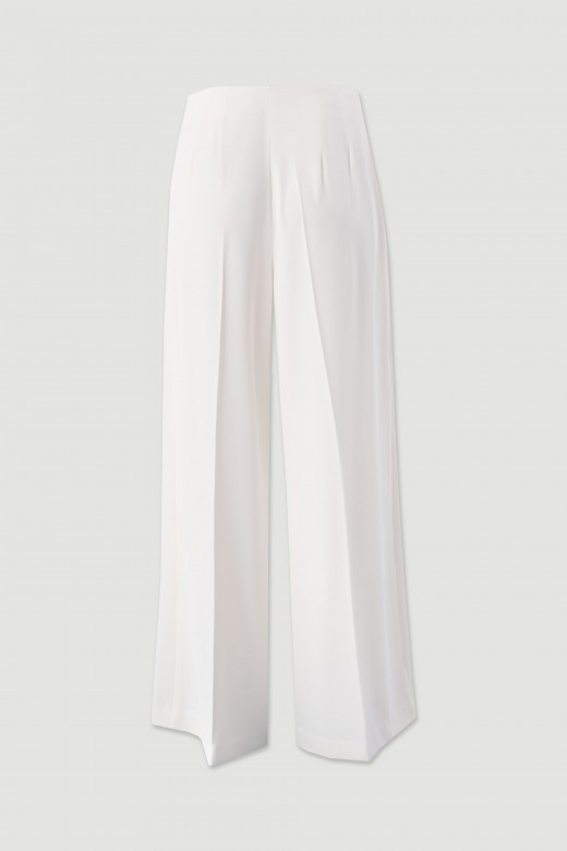 Flowing trousers with cross-over fastening Flowing trousers with cross-over fastening