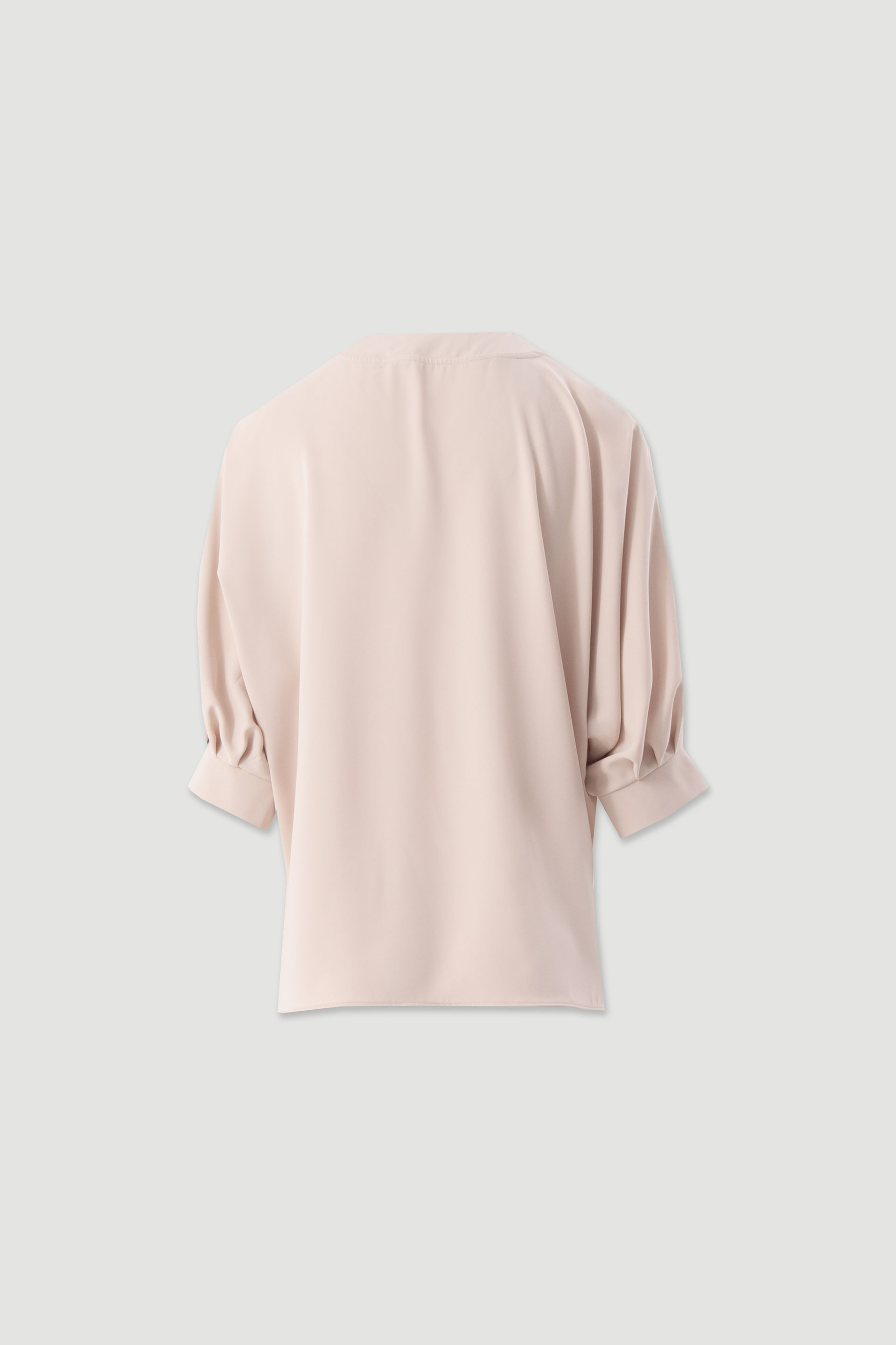 Asymmetrical fluid tunic
