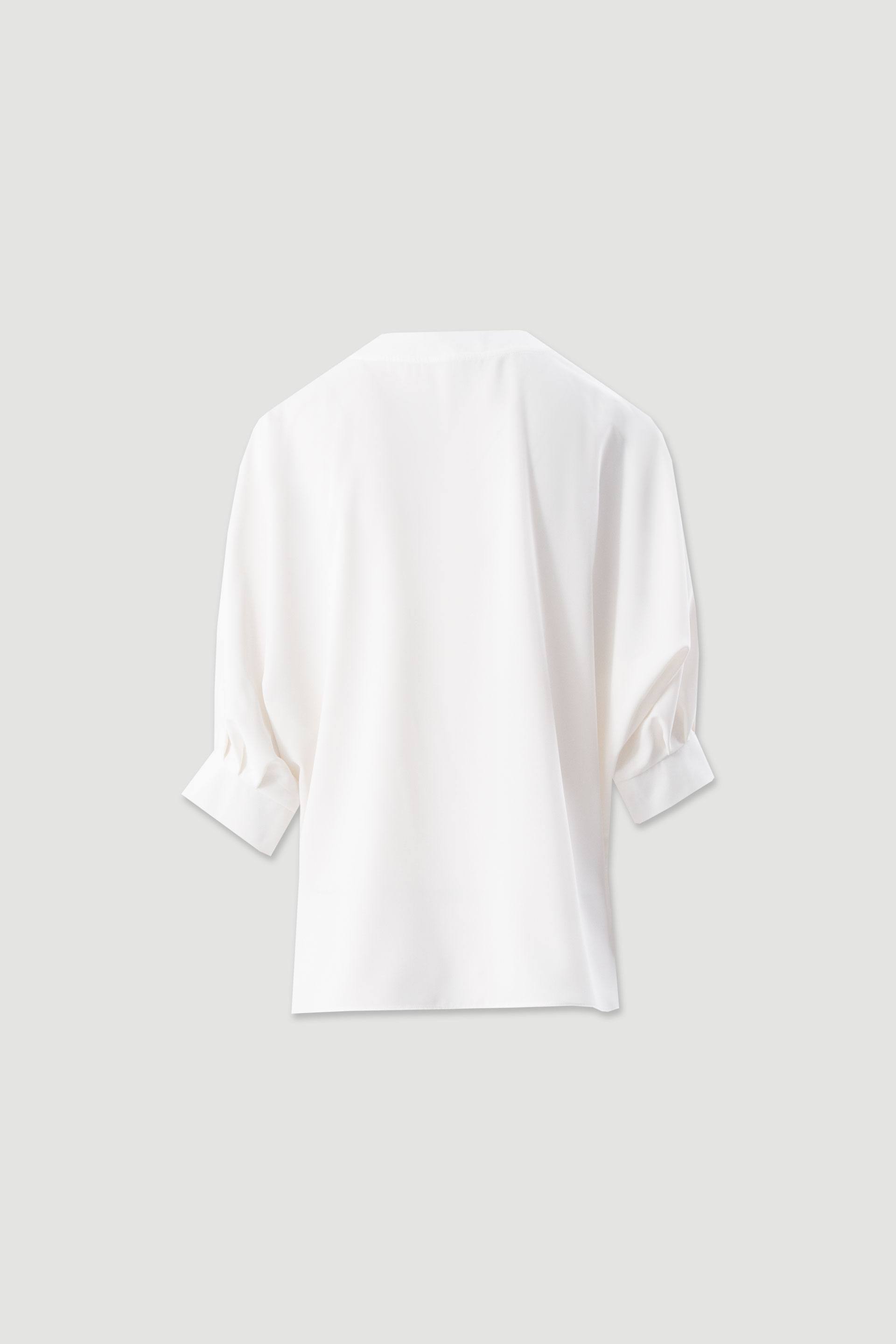 Asymmetrical fluid tunic