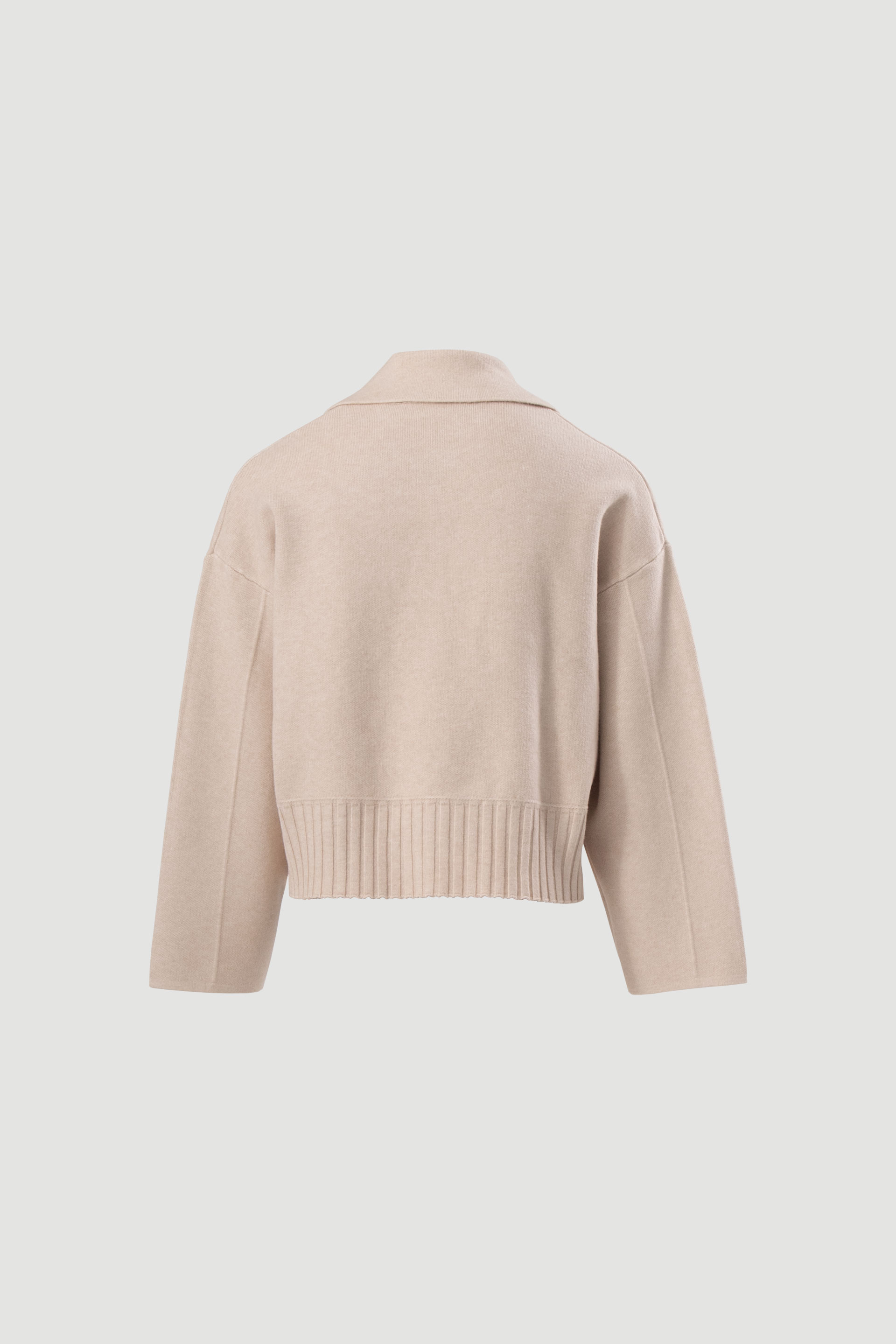 Veste courte en maille à fermeture croisée