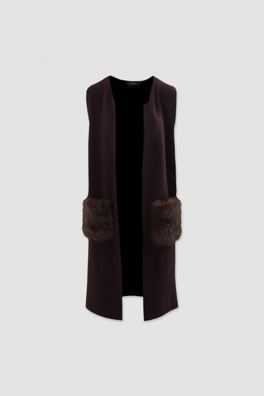 Long knit vest with faux fur pockets Long knit vest with faux fur pockets