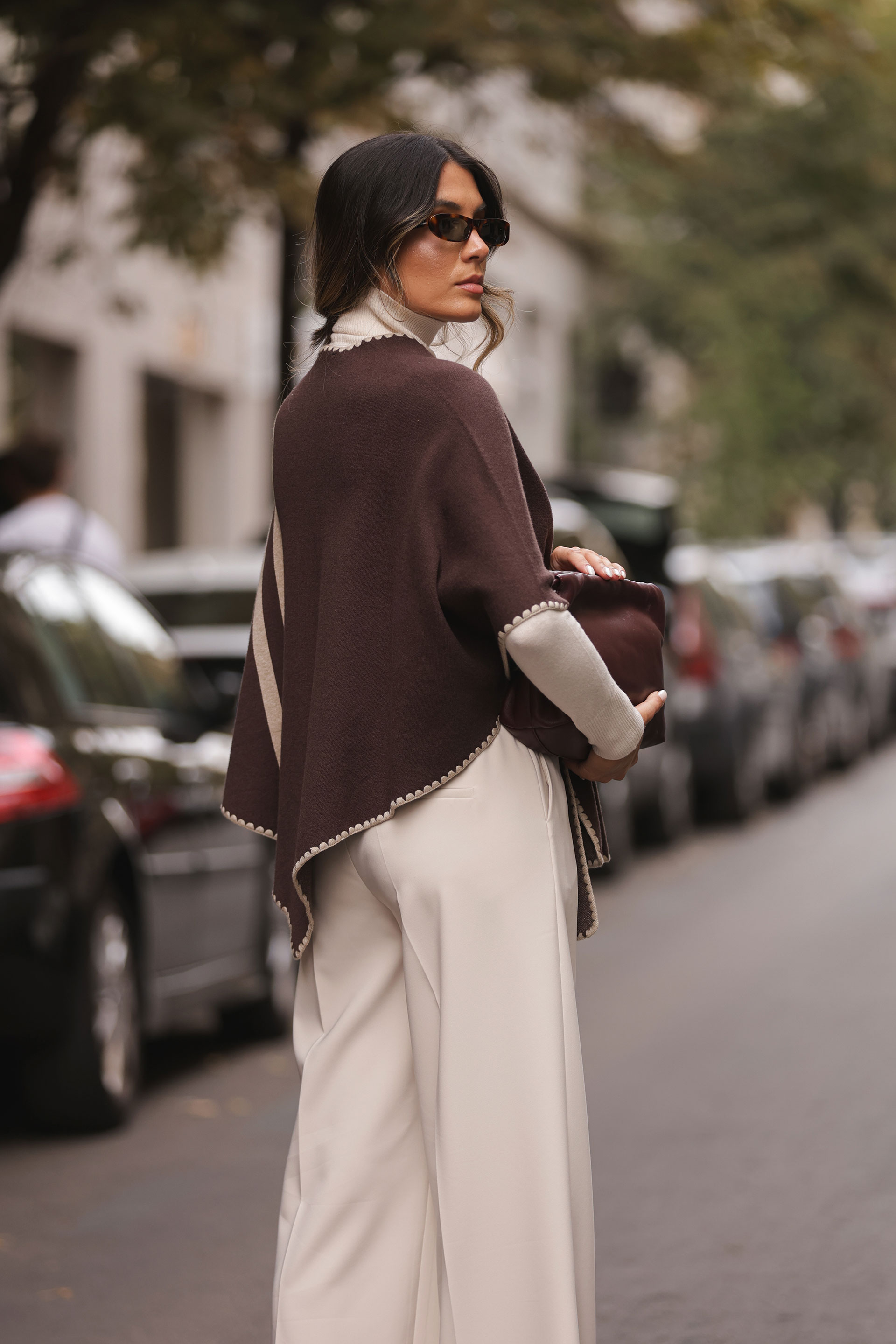 Knit cape with contrasting stripes
