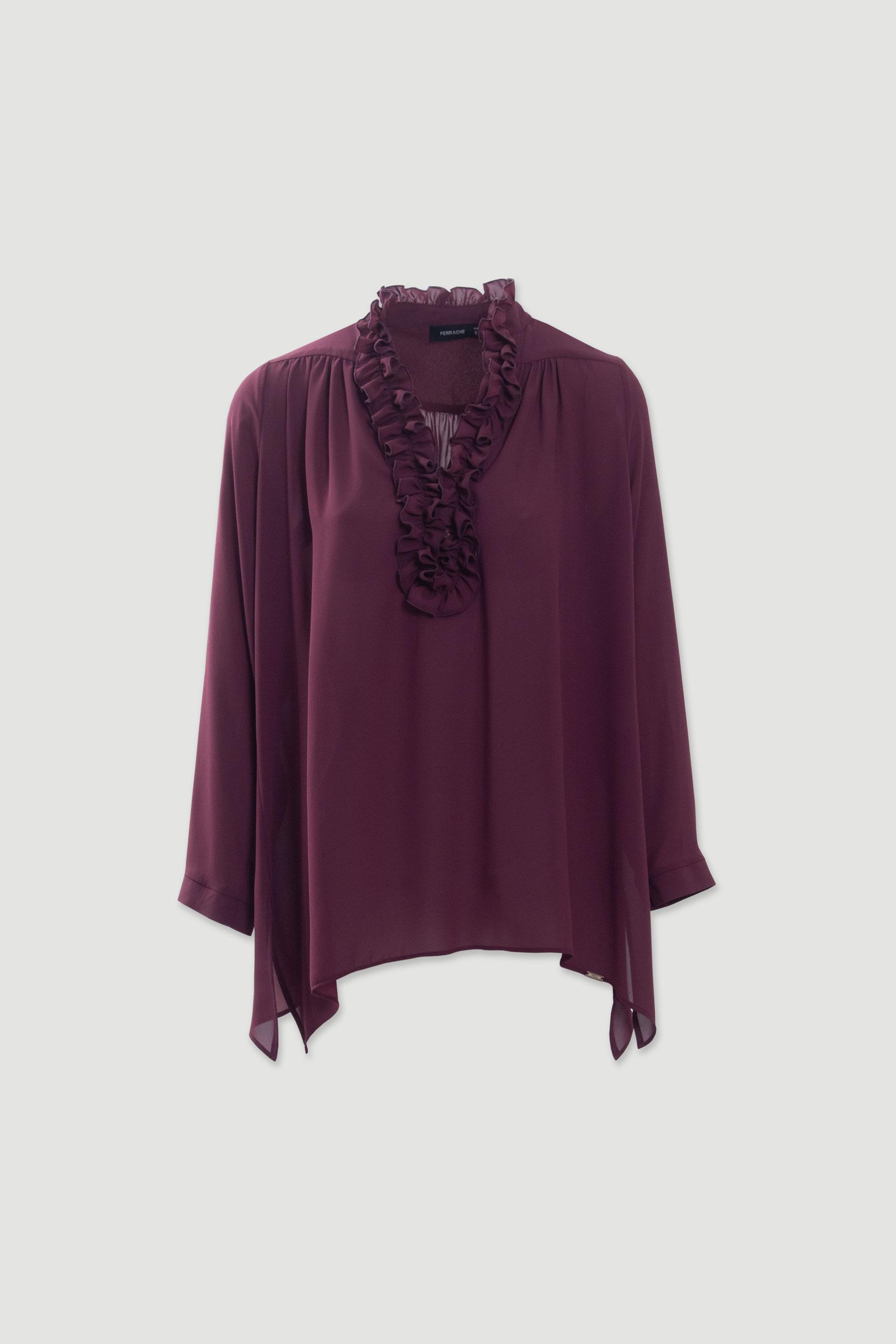Fluid tunic with ruffled neckline