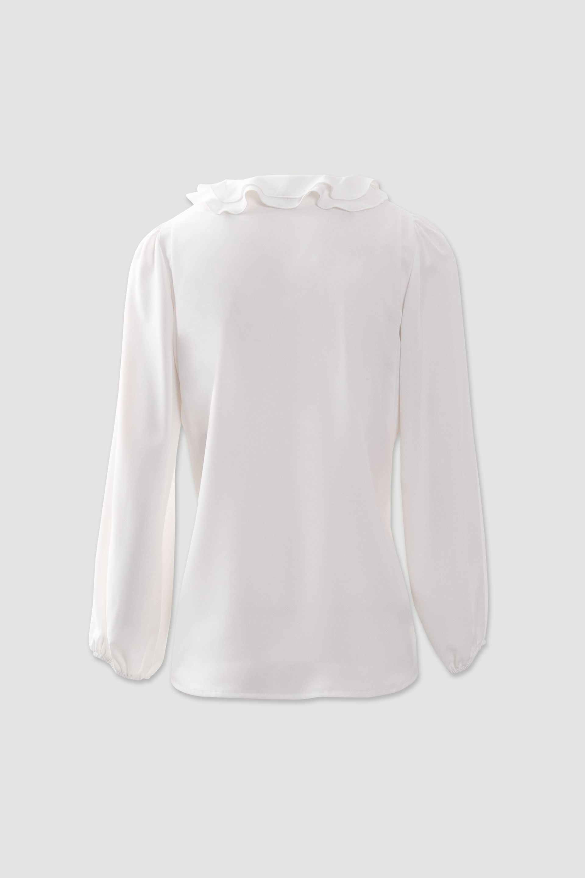 Fluid tunic with ruffled neckline